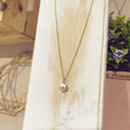 Collar perla estrella dorada